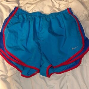 Nike Blue and Red Athletic Shorts with Curved Hem